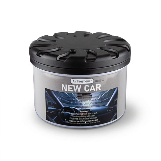 A black-lidded container of air freshener with a label featuring a car interior design.