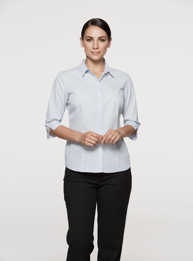 A light blue button-up shirt with 3/4 sleeves, featuring a collar and a logo. Suitable for women's wear.