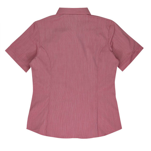 A short-sleeve button-up shirt in a light pink hue, featuring a back yoke and shaping seams. It has a logo.