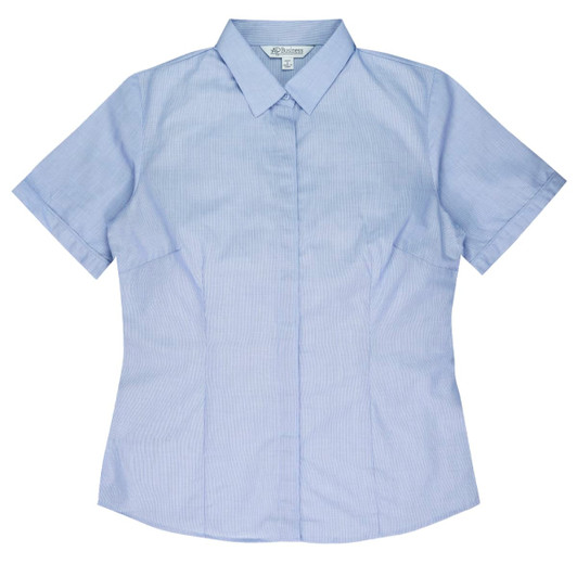 A short-sleeve button-up shirt in light blue with a fitted design, featuring a collar and branding.