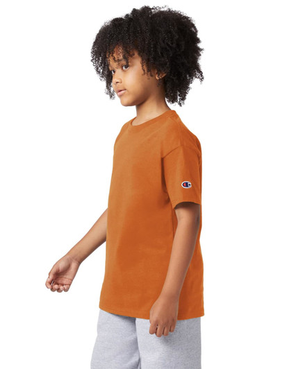 An orange short sleeve t-shirt for youth, featuring a logo on the sleeve.