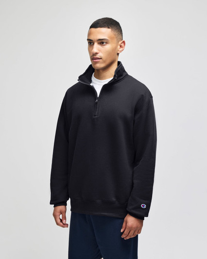 A black Champion Powerblend® adult quarter-zip pullover, featuring a high collar and a logo on the sleeve.