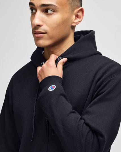 A black Champion Powerblend® adult full-zip hooded sweatshirt featuring a logo on the sleeve.