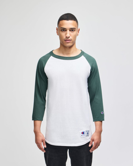 A men's raglan baseball T-shirt with white body and green sleeves, featuring a logo on the hem.