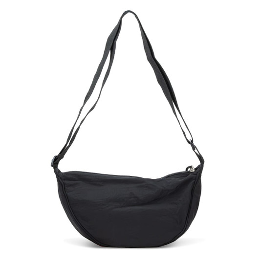 A black shoulder bag with a curved shape and two adjustable straps, featuring a logo on the front.