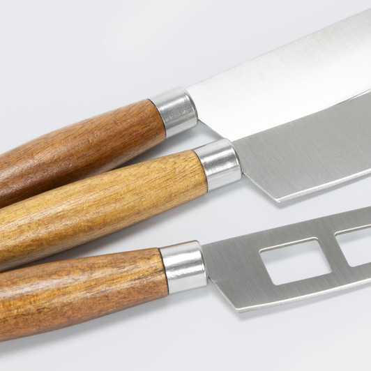 Three cheese knives with stainless steel blades and wooden handles in light and dark brown.