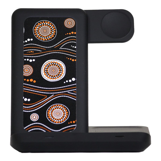 A wireless charger featuring a black base with an intricate orange and white Aboriginal-inspired design.