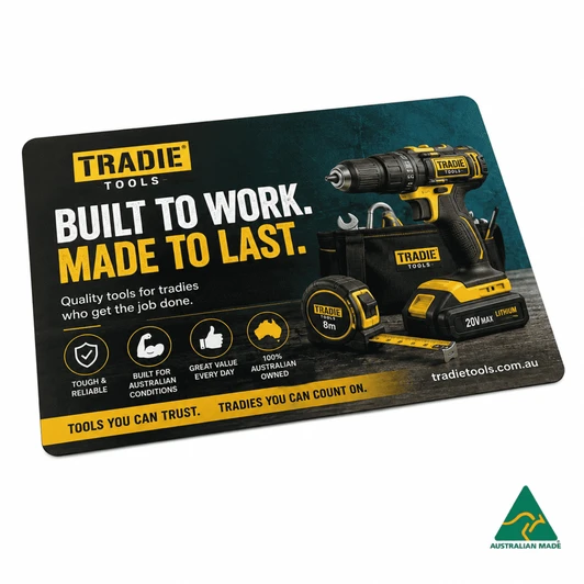 A promotional mouse mat featuring a black and yellow power drill, with a logo and various tool images on a textured background.