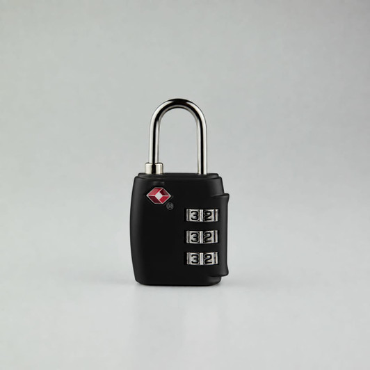 A portable black luggage TSA lock with a silver shackle and three rotating dials for the combination.