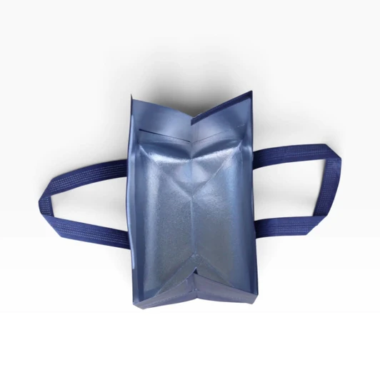 An insulated reusable bag in blue with two handles, displayed from a top-down view.