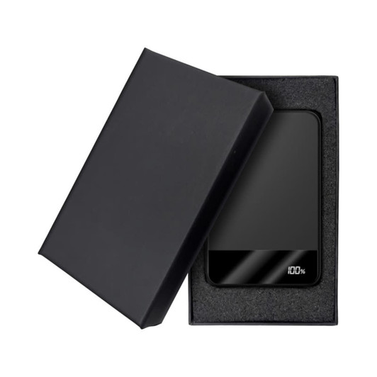 A black MagSafe wireless power bank is displayed inside a black box, featuring a sleek design and an LED charge indicator.