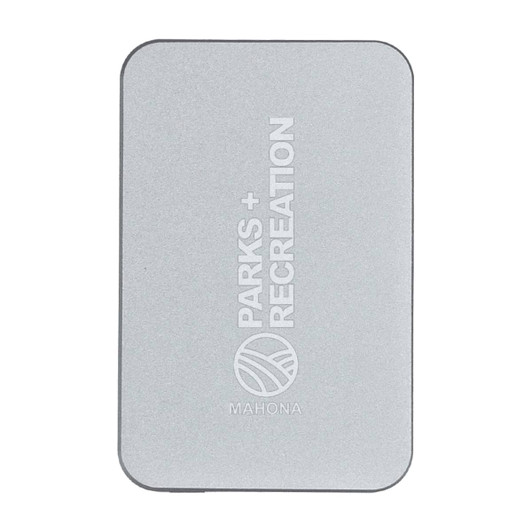 A silver power bank with a minimalist design and a logo. It features rounded corners and a sleek finish.