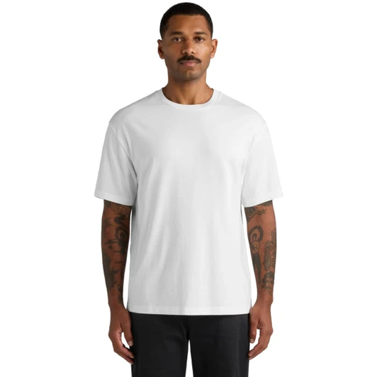 A white t-shirt featuring a relaxed fit, displayed on a model with tattoos. The shirt has a simple design and a logo.