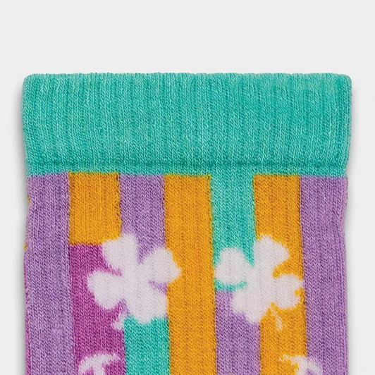 Multicoloured knitted socks featuring purple, orange, and turquoise stripes with white floral designs. Includes a logo.