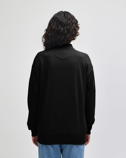 A black unisex bomber jacket with a relaxed fit, featuring a round neck and long sleeves.