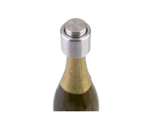 A drink bottle featuring a silver champagne stopper on top, with an ornate label partially visible on the neck.