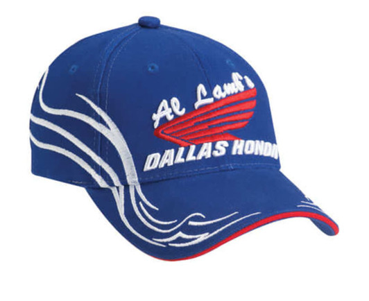 A blue cap featuring decorative white stitching and a logo on the front. It has a red accent on the brim.