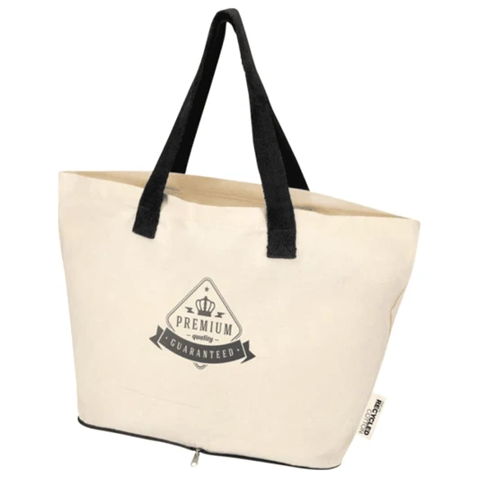 A cream foldable tote bag with black handles and a logo on the front, made from recycled cotton.
