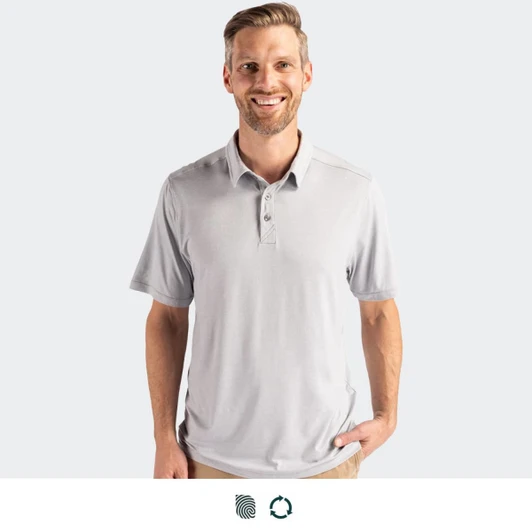 A grey polo shirt with a three-button placket and a logo. The model is smiling while standing against a plain background.