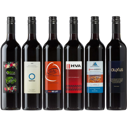 A selection of red wine bottles featuring various designs and labels, mostly in dark burgundy and black colours.