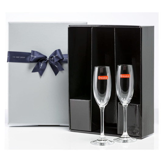 A gift box containing two elegant champagne flutes with a sleek black interior and a decorative ribbon.