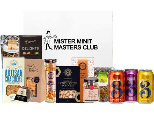 A selection of gourmet snacks and beverages in a box, featuring crackers, popcorn, nuts, and canned beers. Includes a logo.