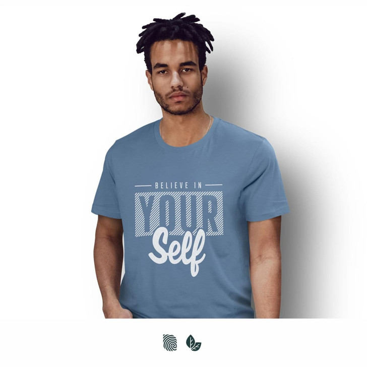 A man wearing a blue unisex t-shirt with a logo and bold graphic text design.