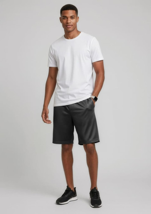 A model wearing black sports shorts and a plain white t-shirt, standing against a neutral background.