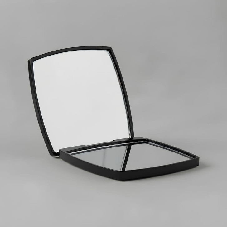 A compact mirror with a sleek black exterior, featuring two reflective surfaces inside. It has branding visible.