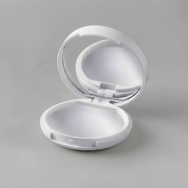 A white compact with a mirror, designed for lip gloss or lip balm. The interior is smoothly finished.