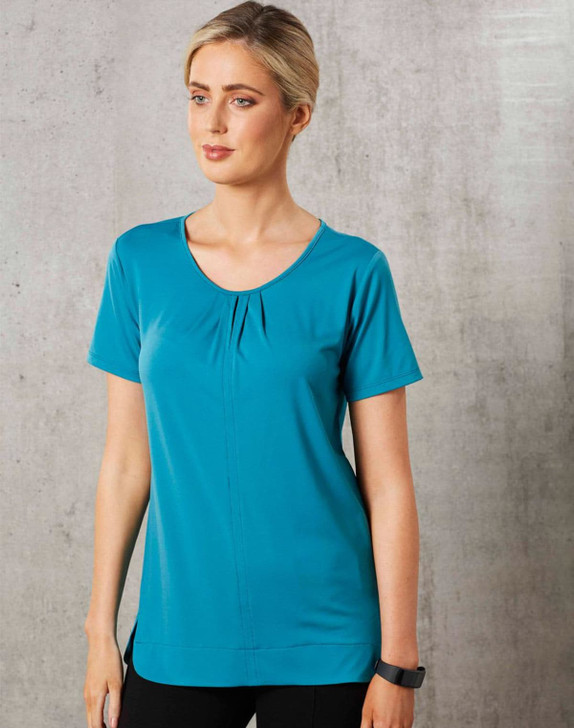 Teal ladies' round neck knit top with pleats and short sleeves, featuring a logo. Smooth fabric and a relaxed fit.