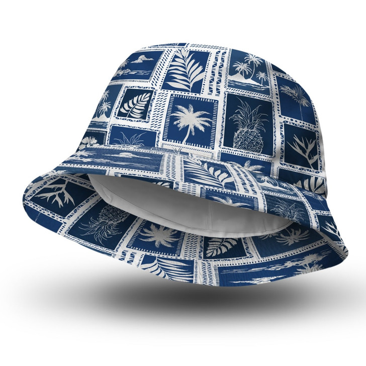 A navy bucket hat featuring a white tropical print design, with a logo on it. The interior is lined in white.
