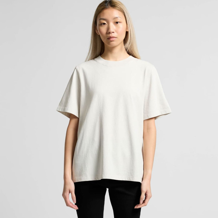 A light cream, oversized t-shirt with short sleeves and a relaxed fit, featuring a logo on the front.