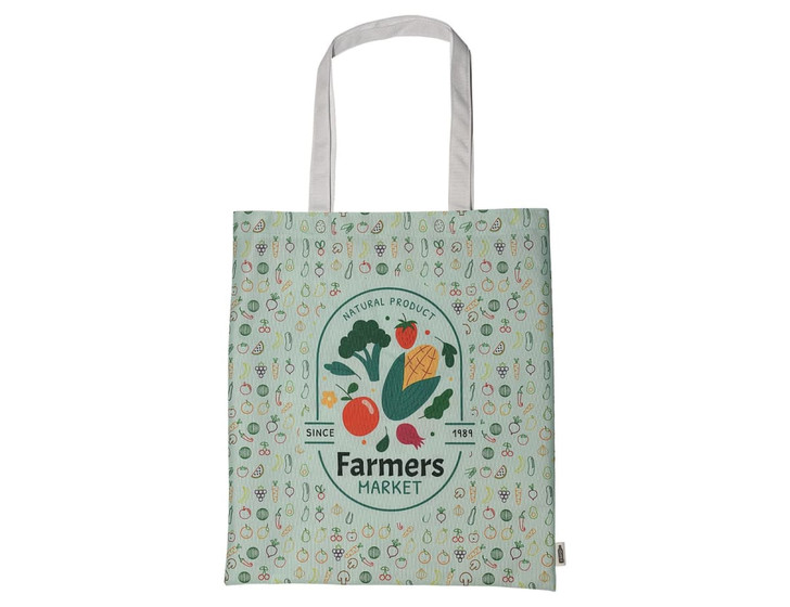 A green tote bag featuring a variety of vegetables and a circular logo, with white handles and a patterned background.
