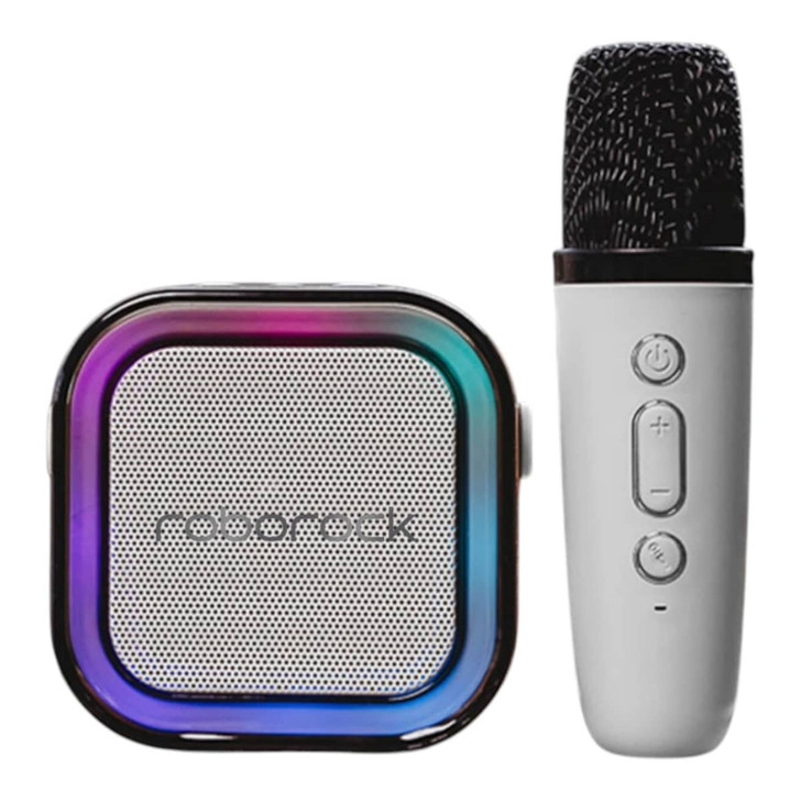 A portable karaoke machine in black and white, featuring a speaker with a multicoloured edge and a handheld microphone.