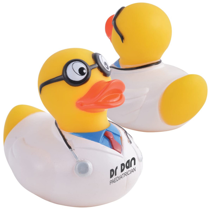 A yellow rubber duck dressed as a doctor, featuring glasses and a stethoscope, with a white coat and branding.