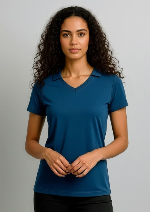 A women's short sleeve polo in deep blue, featuring a collar and a fitted silhouette, with branding.