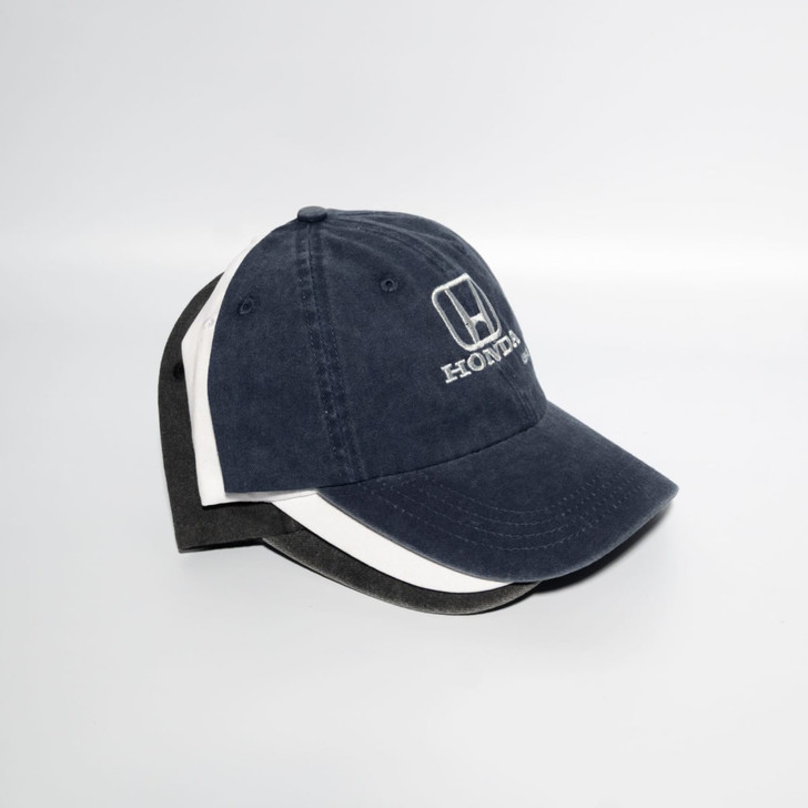 A navy blue baseball cap with a grey and white accent, featuring a logo on the front.