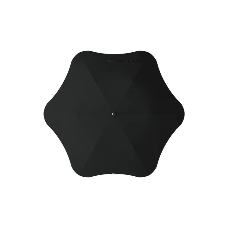 A black BLUNT Metro Umbrella with a unique shape and central button. It features a minimalist design.