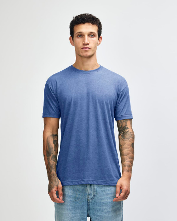 A blue American Apparel tri-blend t-shirt displayed on a model, featuring a relaxed fit and short sleeves.