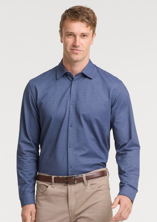 A men's long sleeve shirt in navy blue with a button-down front, paired with beige trousers, featuring a logo.
