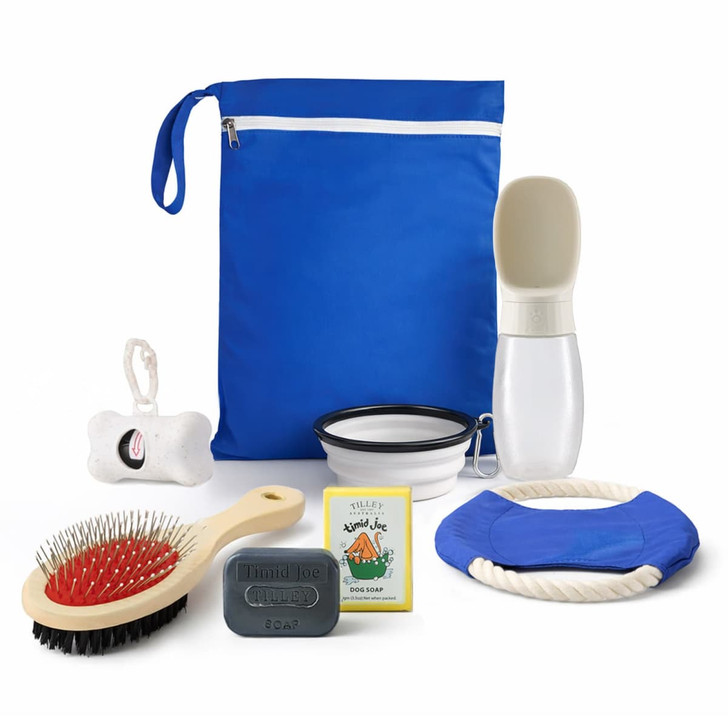 A blue pack containing a drink bottle, bowl, brush, toy, soap, and a grooming glove.