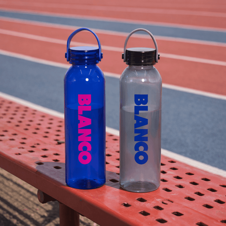 A drink bottle set featuring a blue and a clear design, both with a logo and cap, resting on a bench.