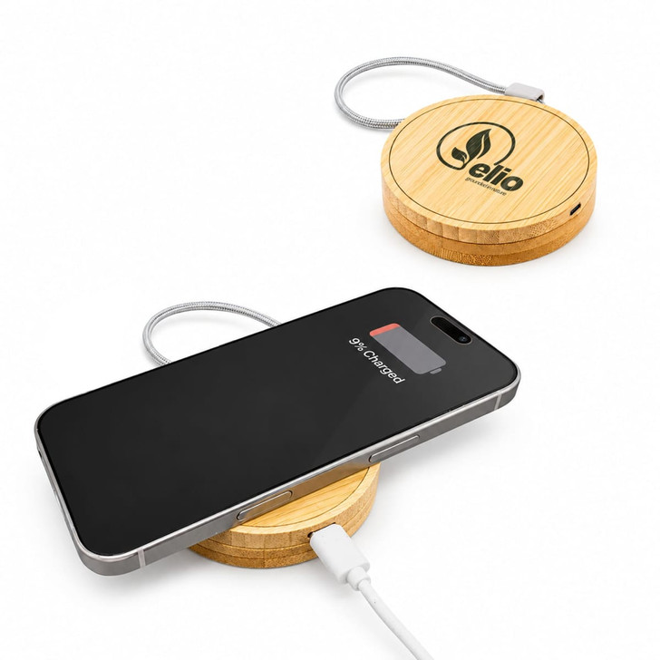 A wireless charger set featuring a bamboo base and a connected charging cable, with a smartphone placed on top.