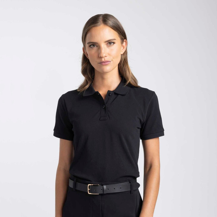 A women's polo shirt in black with a classic collar and short sleeves. It features a logo on the chest.