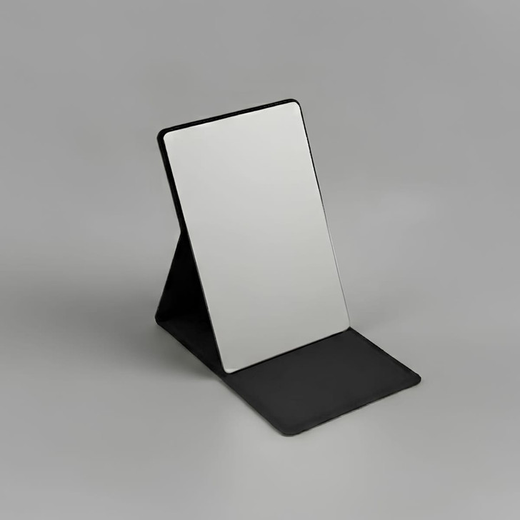 A compact mirror with a sleek black stand, featuring a reflective surface and a minimalist design.