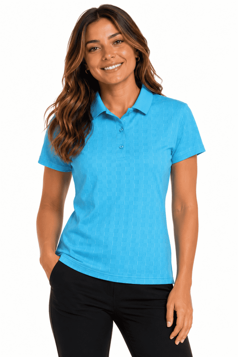A woman in a light blue polo shirt with a collar, featuring a logo, paired with black pants.