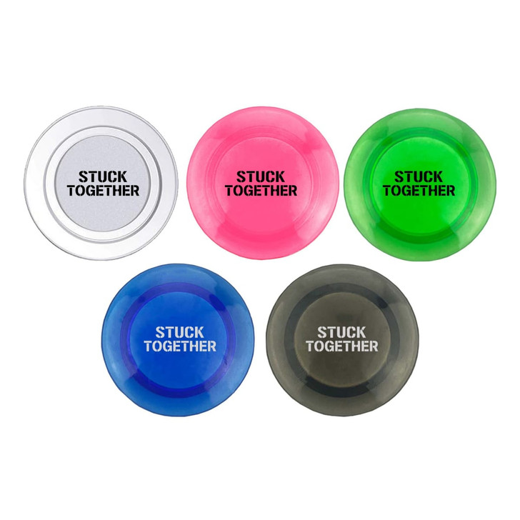 A set of five plastic button magnets in clear, pink, green, blue, and black colours, featuring "Stuck Together" text.