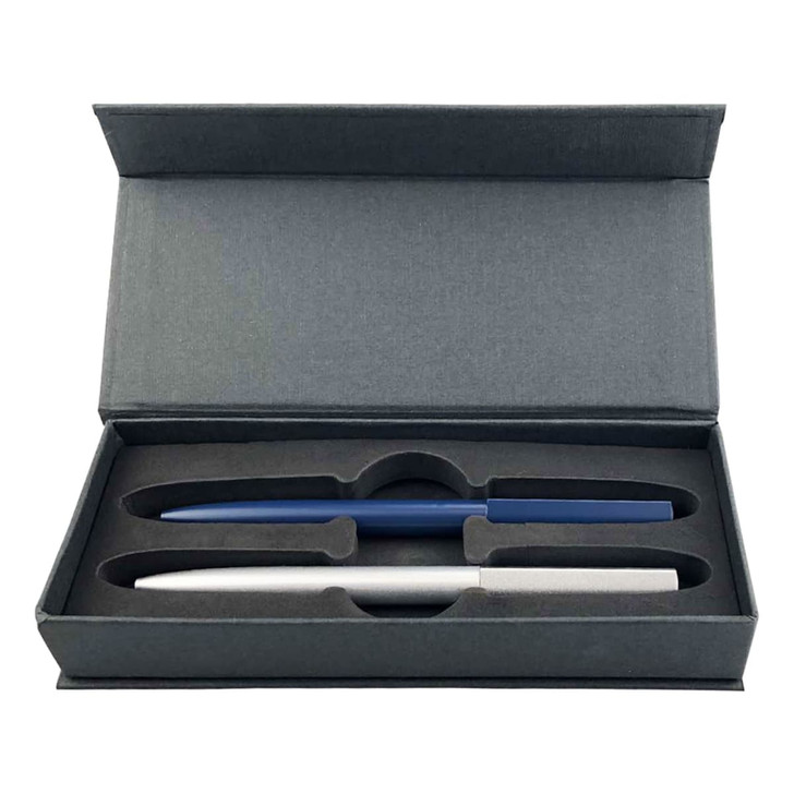 A gift box containing two metal pens, one silver and one blue, in a padded interior.