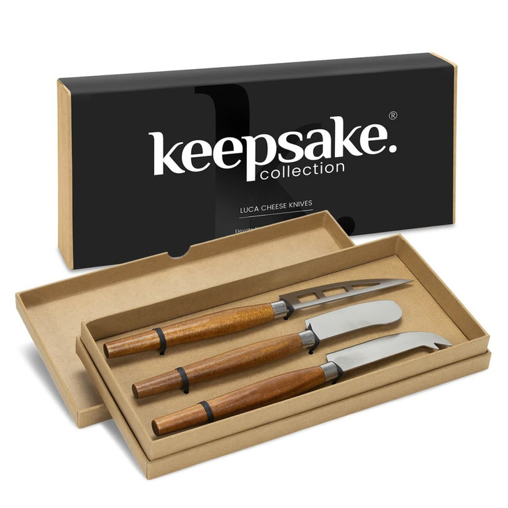 A set of three cheese knives with wooden handles in a gift box, featuring a black branding logo.